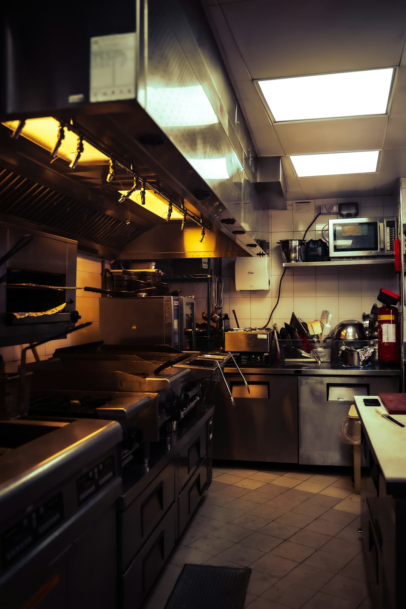 Stainless steel workstations in a professional restaurant kitchen